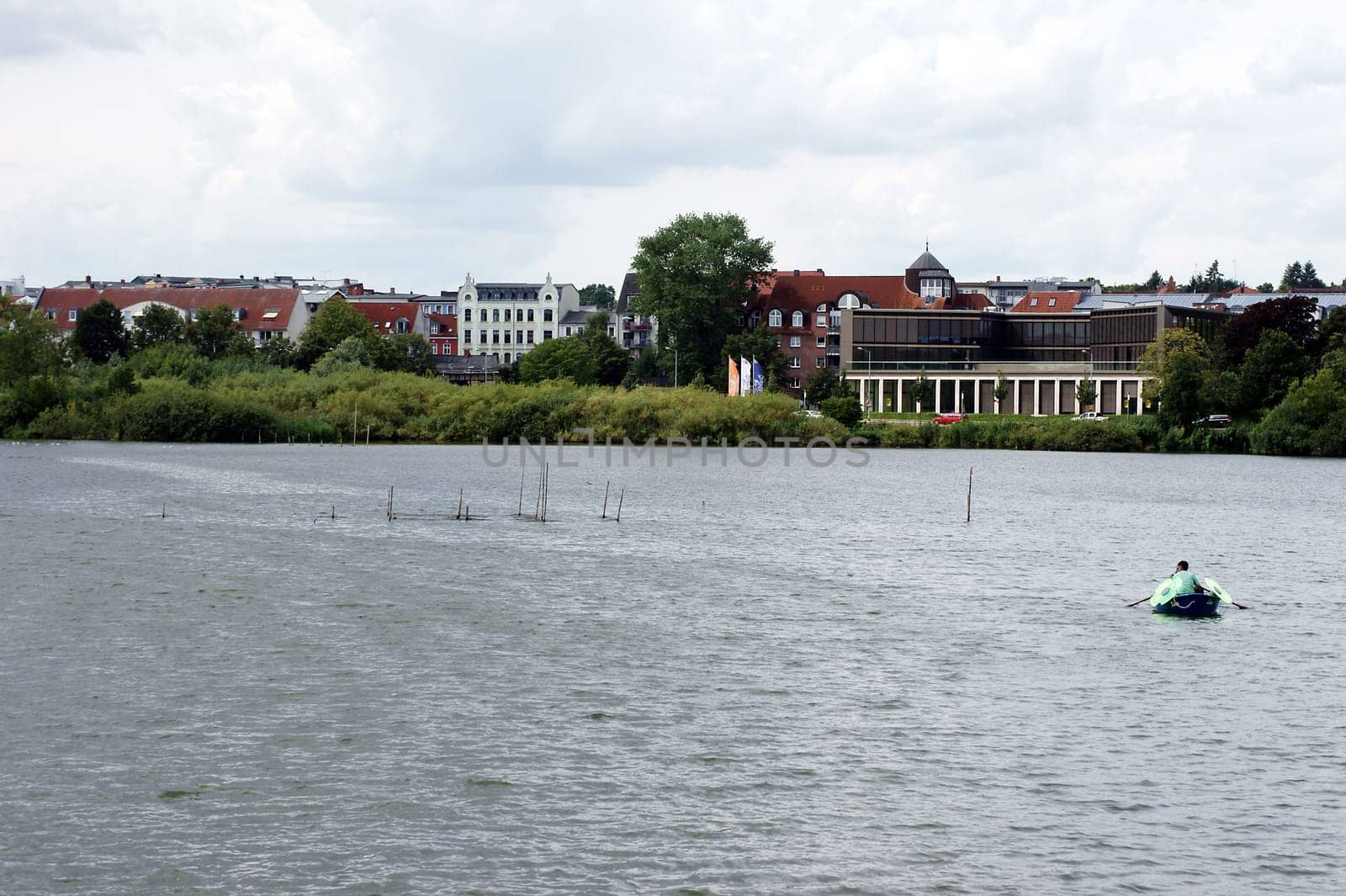 Schwerin,Germany – August 11,2013: A fisherman lays out pots on Lake Schwerin to catch fish on August 11,2013 in Schwerin.