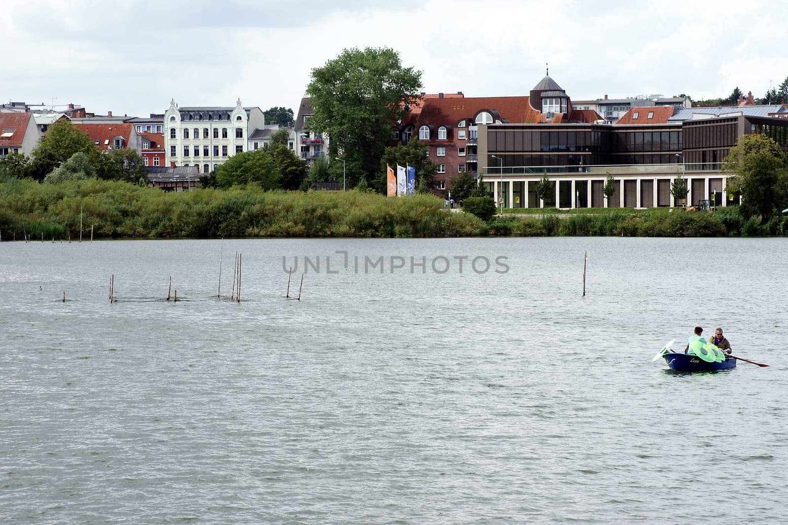 Schwerin,Germany – August 11,2013: A fisherman lays out pots on Lake Schwerin to catch fish on August 11,2013 in Schwerin.