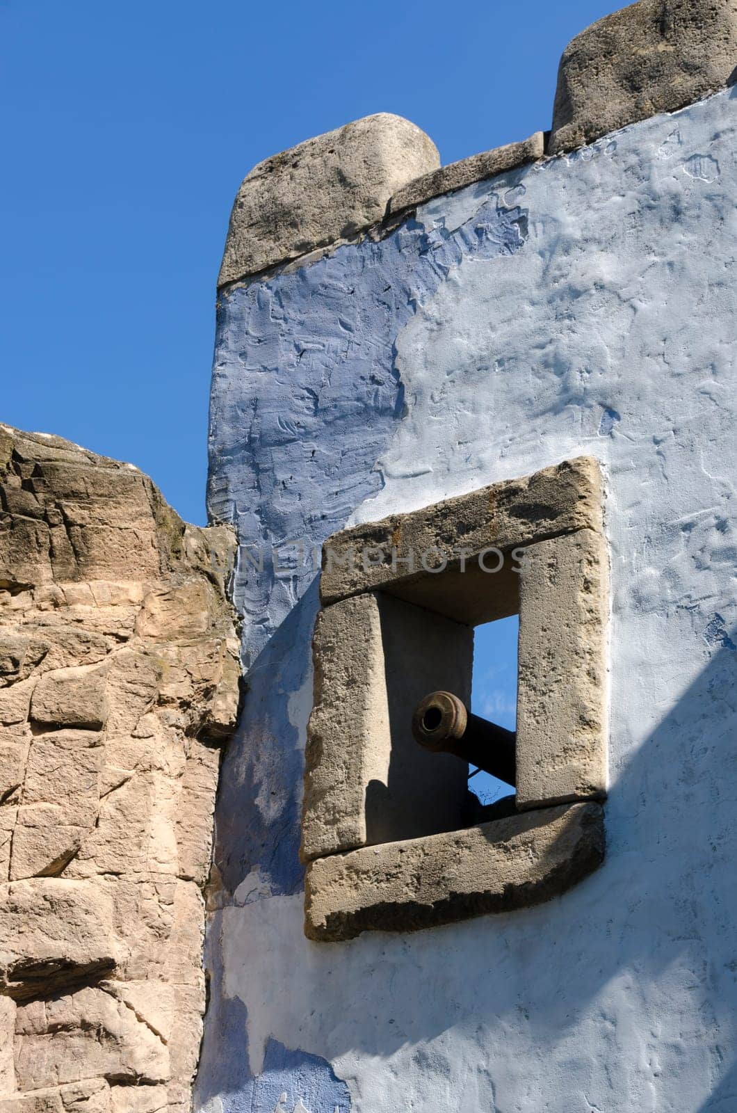window of a castle with cannon
