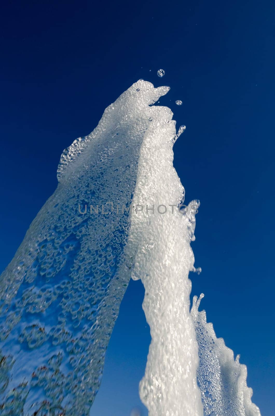 water jet of a fountain with blue sky