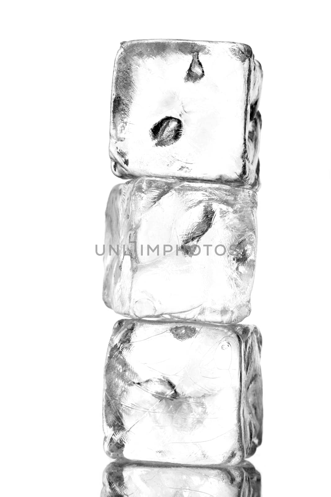 three ice cubes stacked with white background