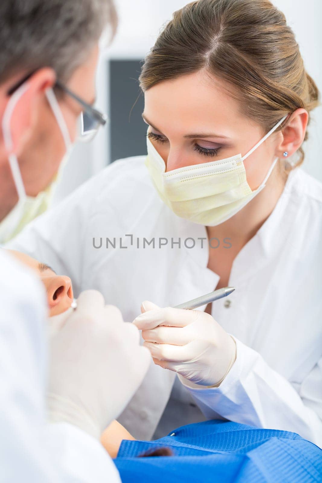 Experienced dentist in his practice