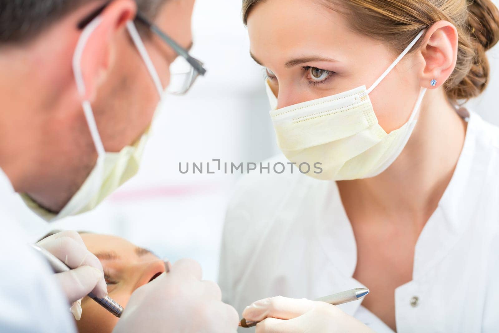 Experienced dentist in his practice