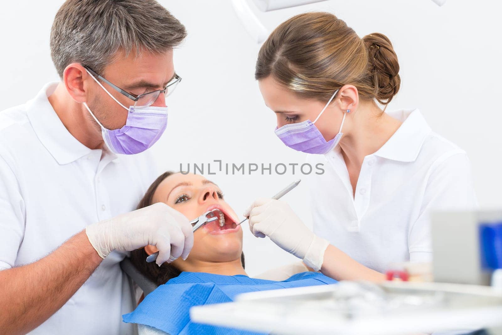 Experienced dentist in his practice