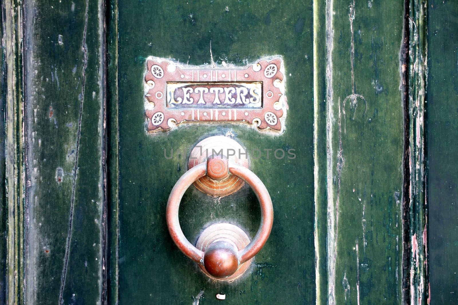 Old door with letterbox background.