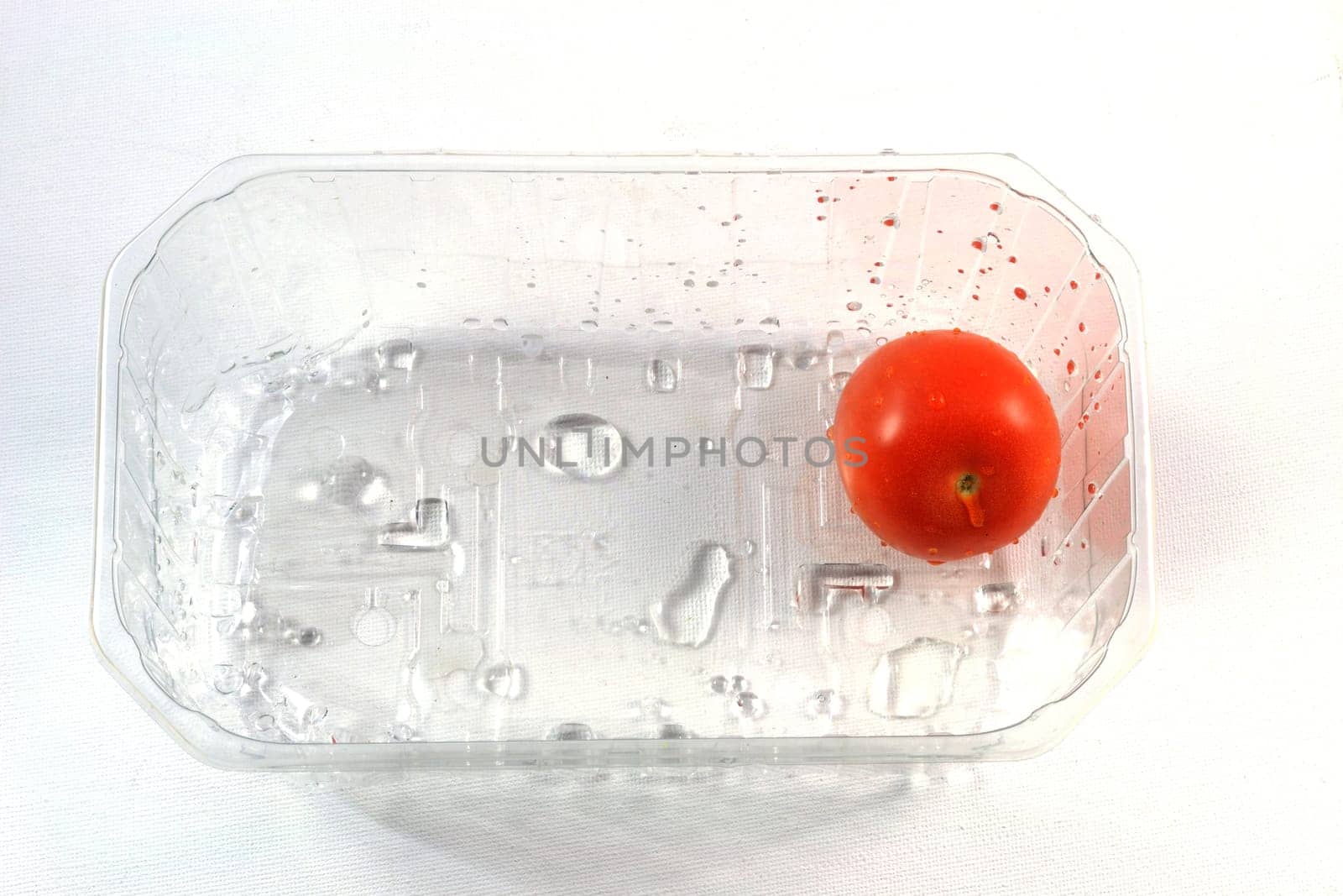 Tomato in transparent packaging