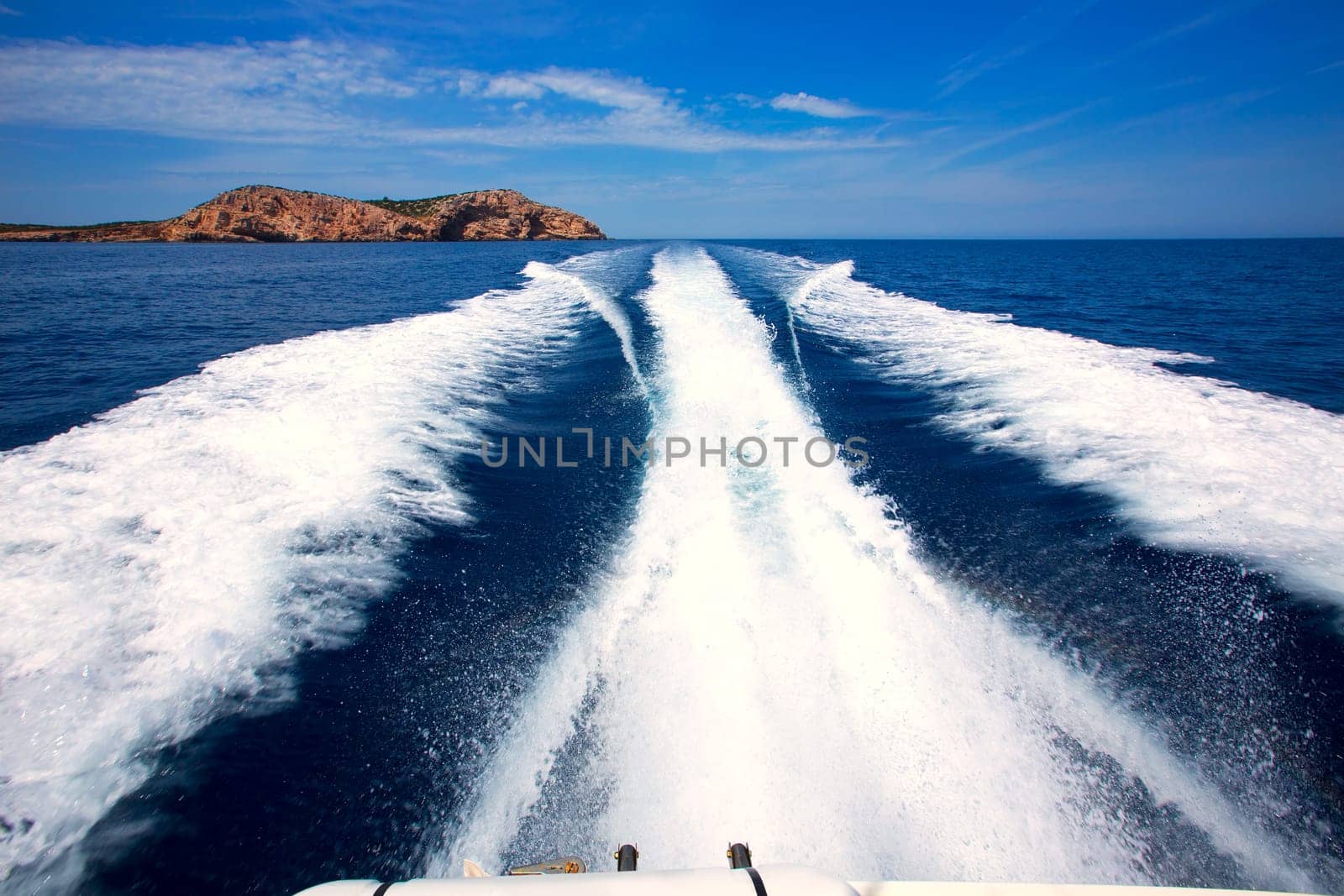 Ibiza Sa Conillera island from boat wake way to San Antonio at Balearic Islands
