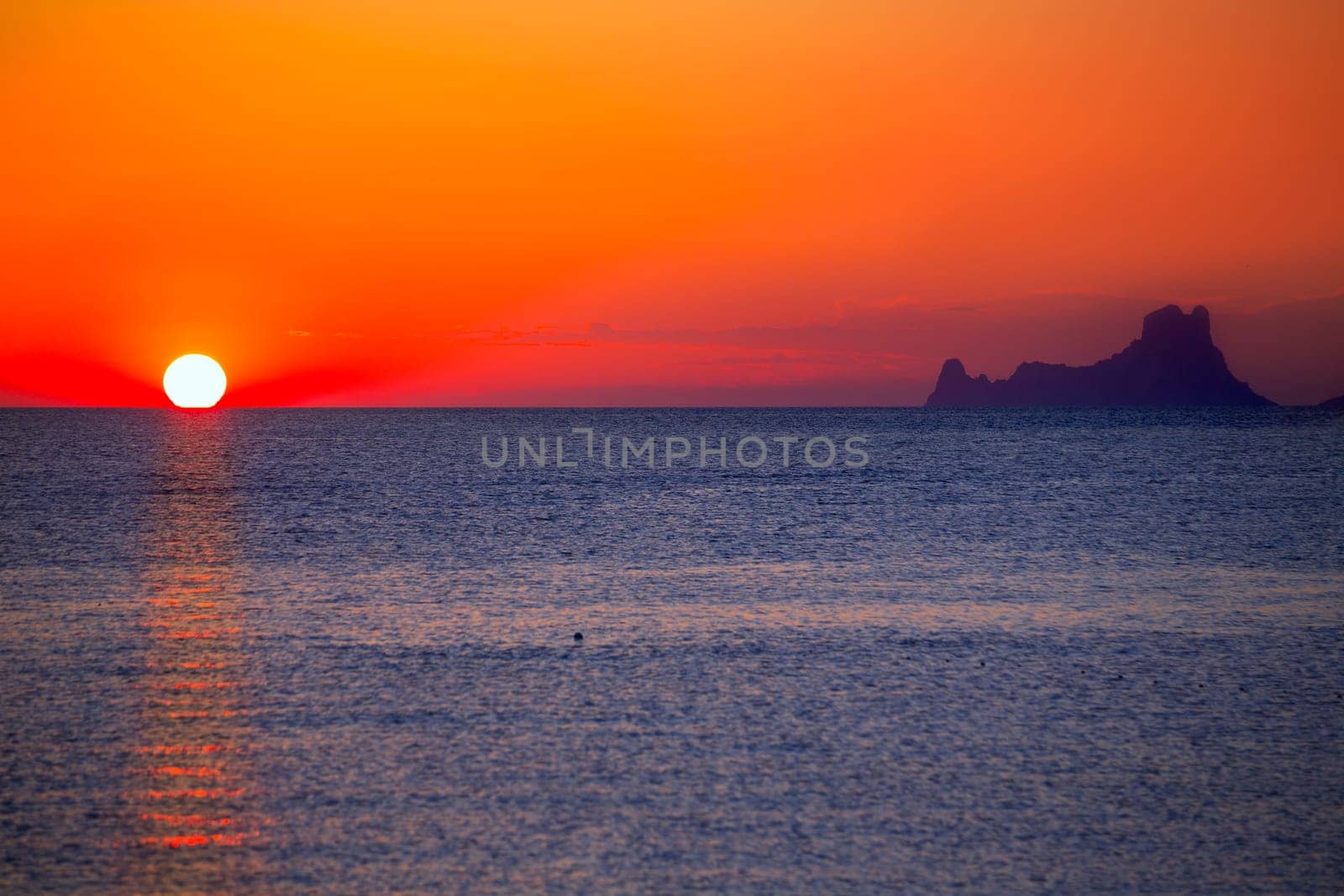 Ibiza sunset Es Vedra view from Formentera la Savina red orange sky