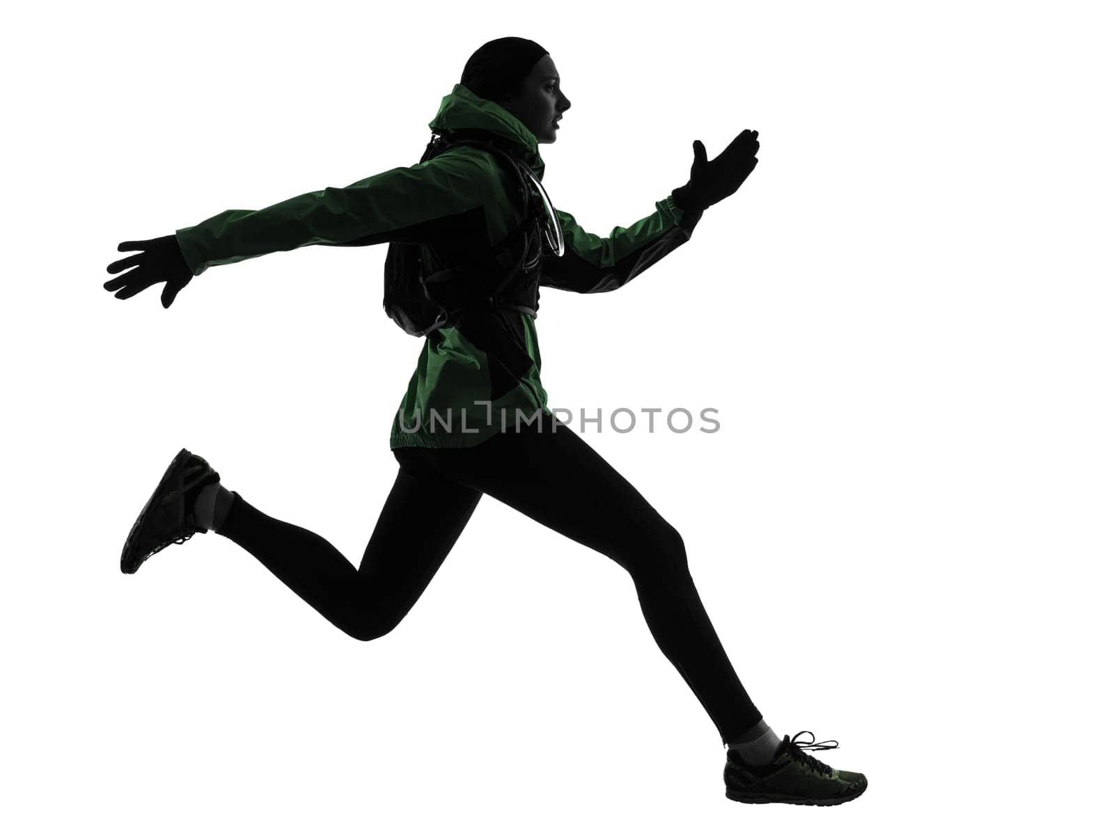 one caucasian woman runner running trekking  in silhouette studio isolated on white background