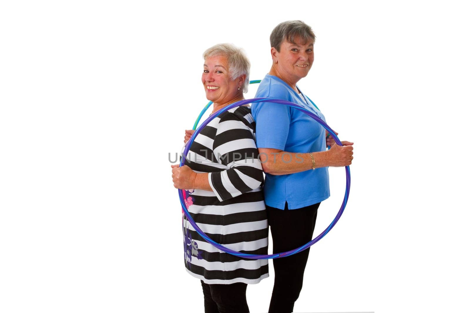Two seniors with Hula Hoop - exposed on white background