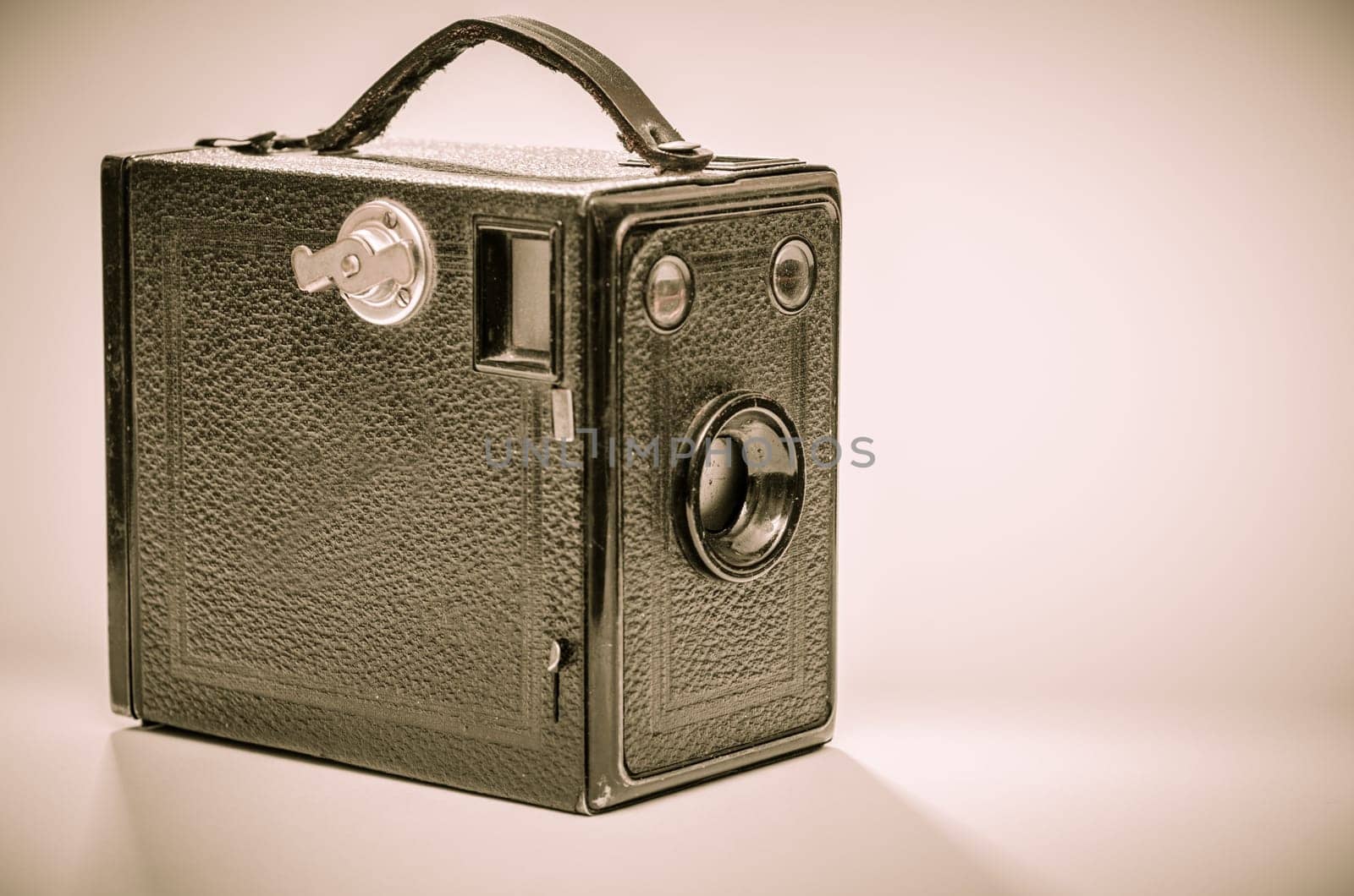 Old box camera in black and white with sepia toning