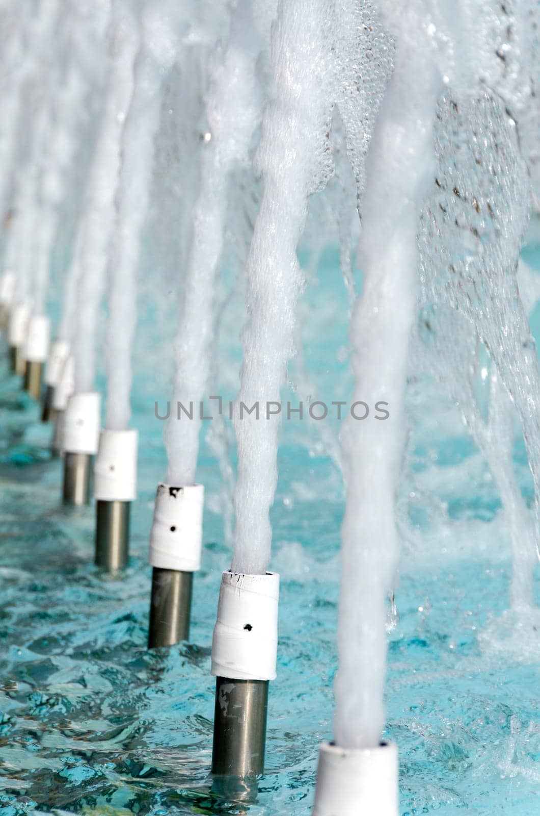 series of fountains in a swimming pool
