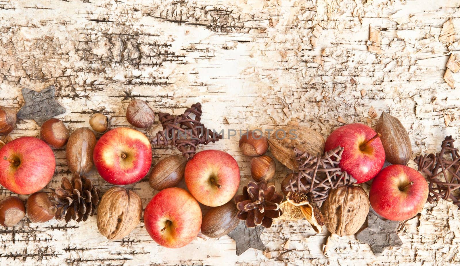 Rustic background with small apples and noodles