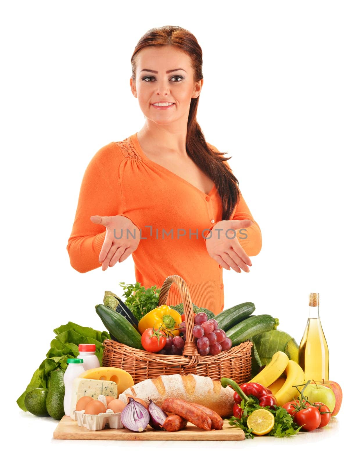 Young woman with assorted grocery products isolated on white background