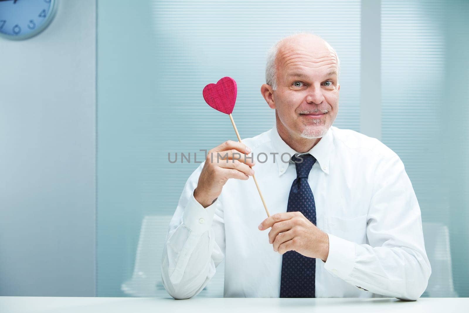 Smiling handsome businessman offering his love