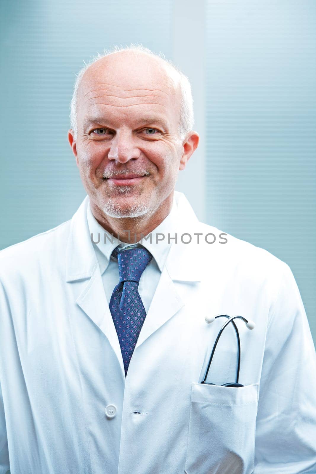 Self confident smiling doctor in white coat