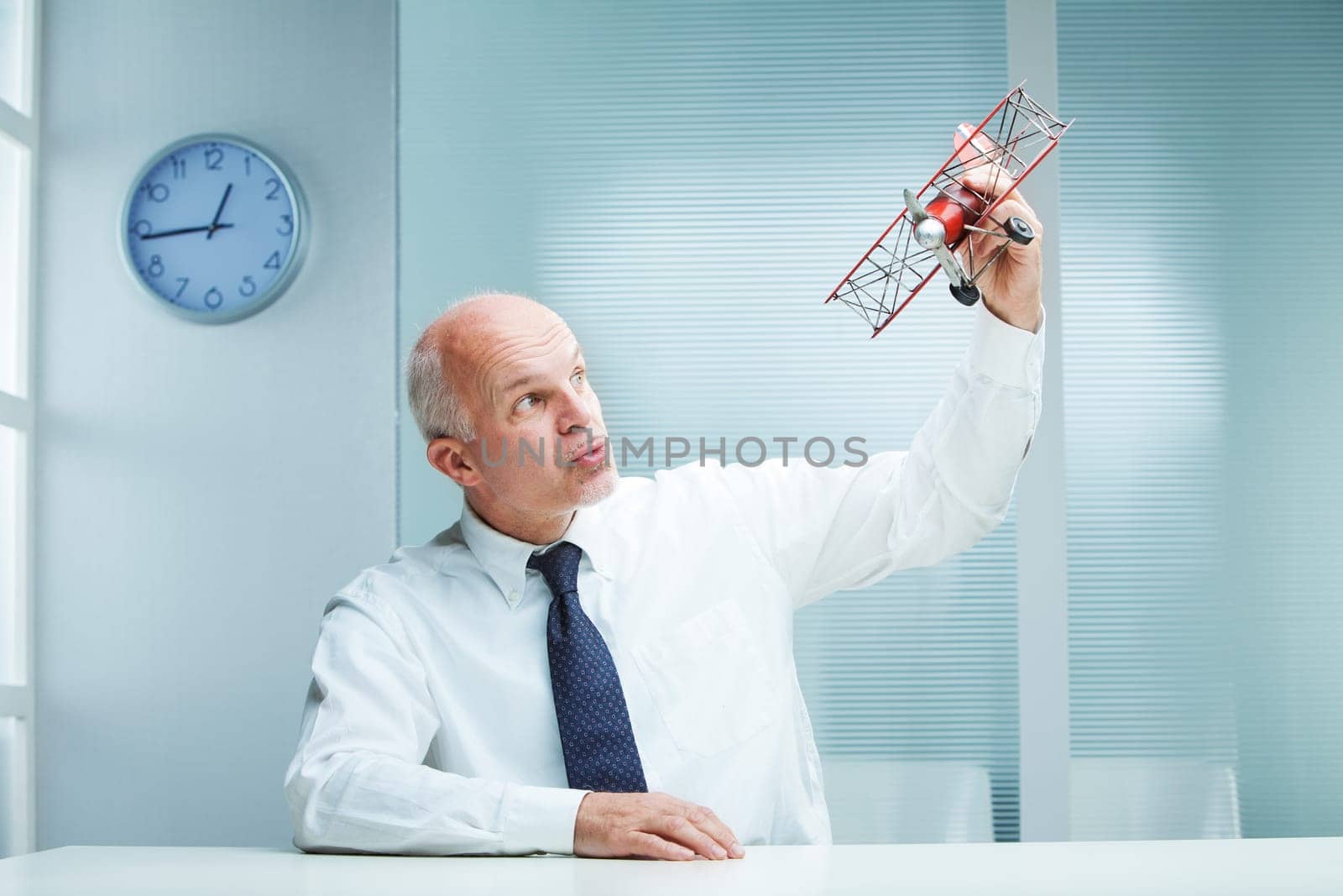 Business Flying Toy Airplane in his office