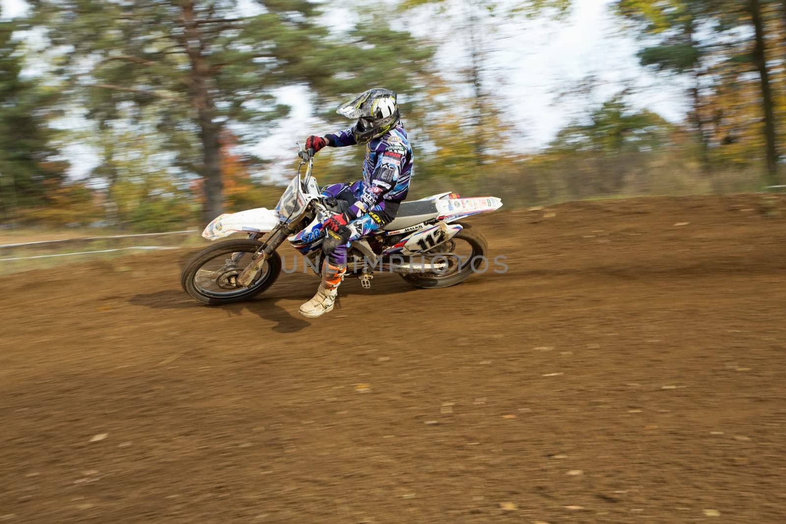 ZABREH, CZECH REPUBLIC - OCT 19.Dynamic shot of motocross rider in turn at Motocross Zabreh Cup on October 19, 2013 in Zabreh, Czech Republic (Central Europe)