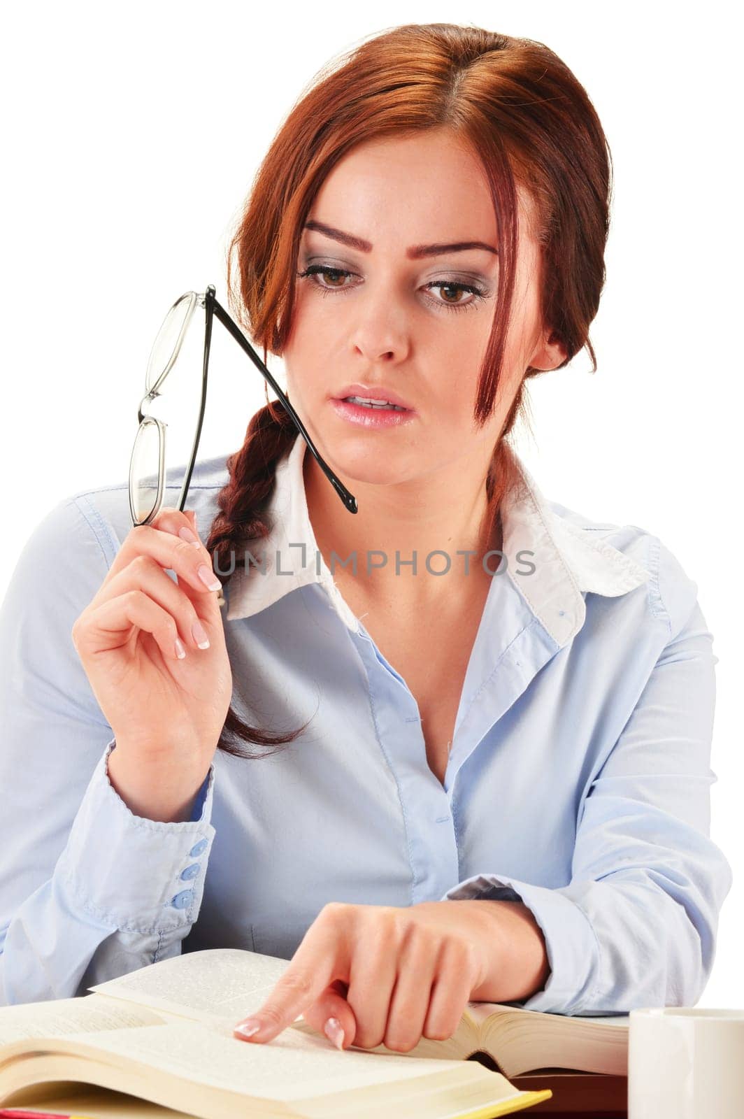 Young woman reading a book. Female student learning.