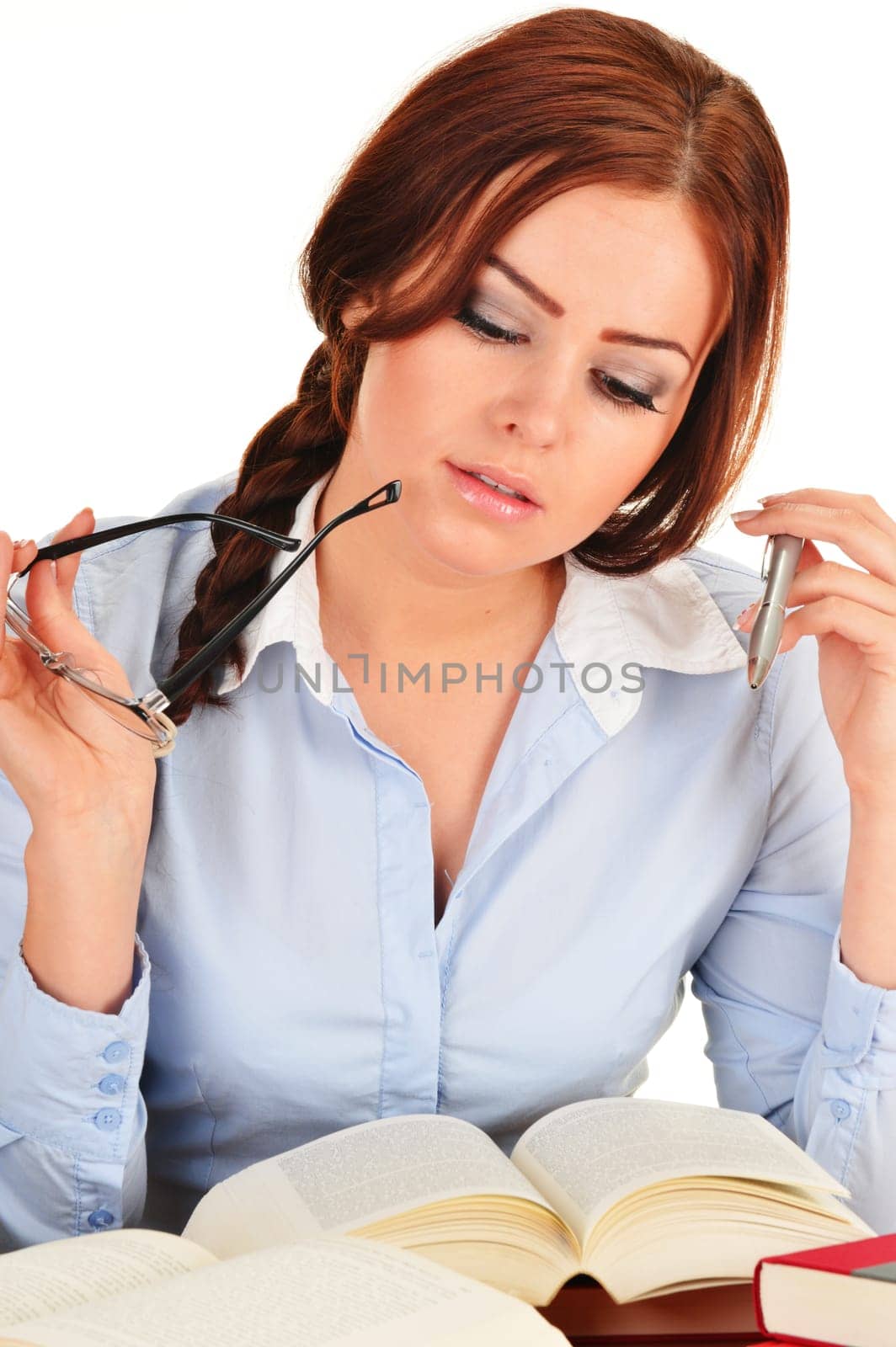 Young woman reading a book. Female student learning.