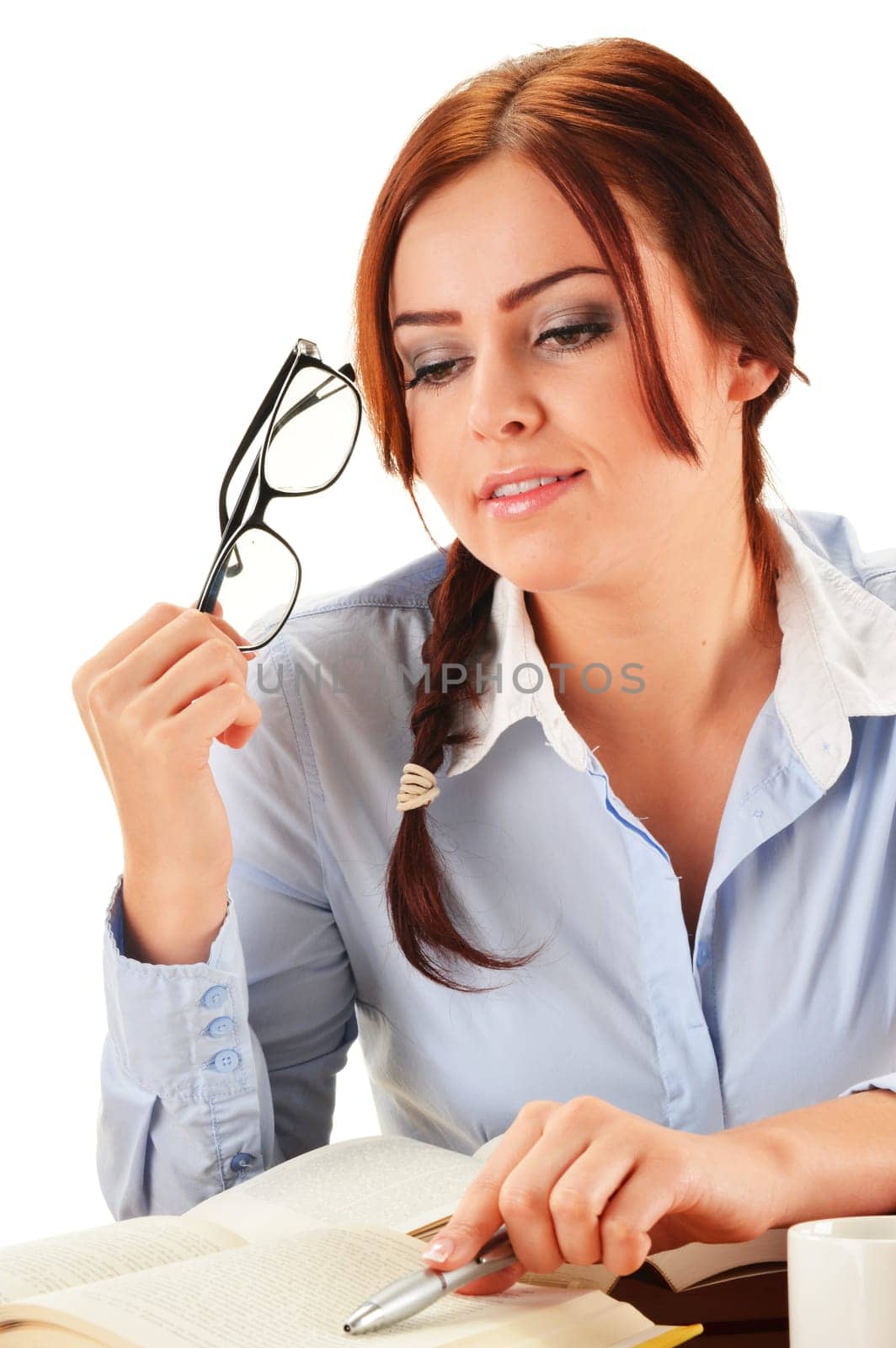 Young woman reading a book. Female student learning.