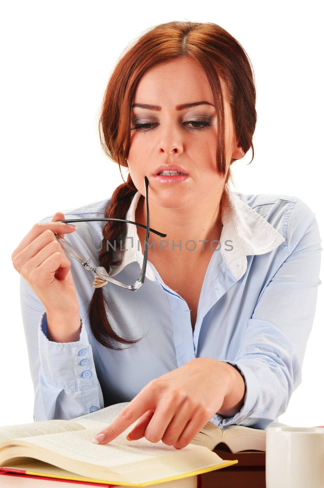 Young woman reading a book. Female student learning.