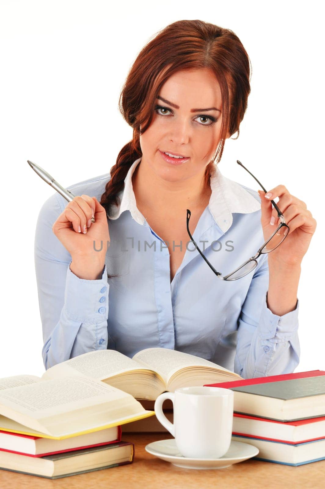 Young woman reading a book. Female student learning.