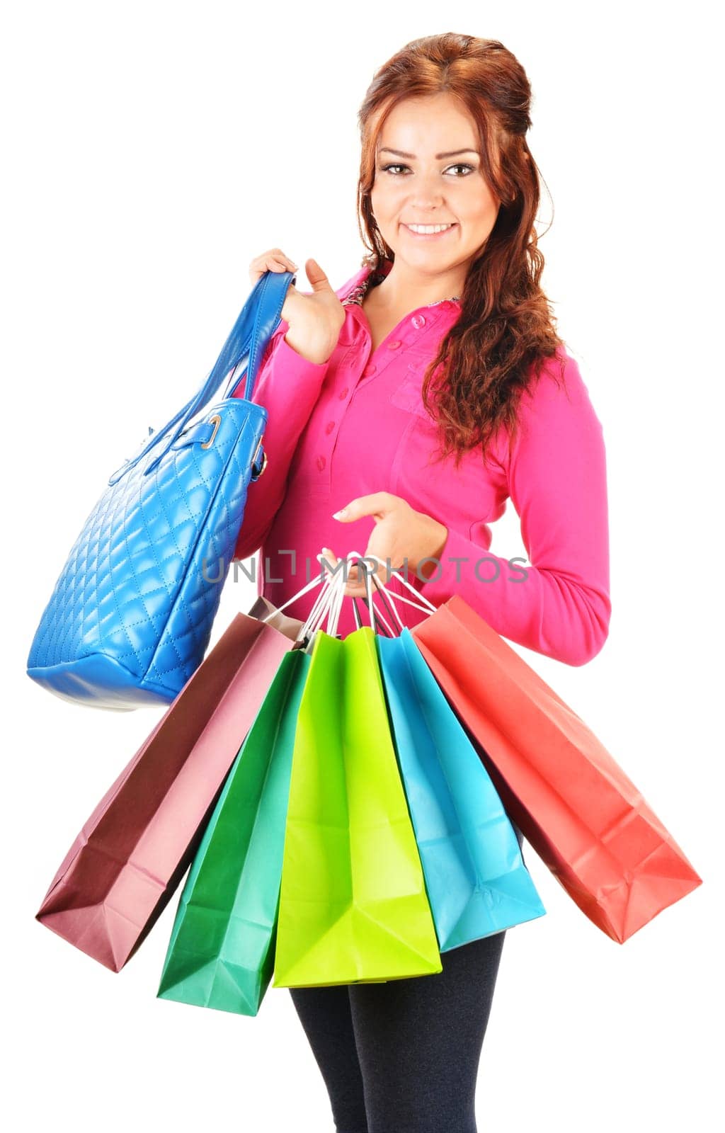 Young woman with shopping bags isolated on white background