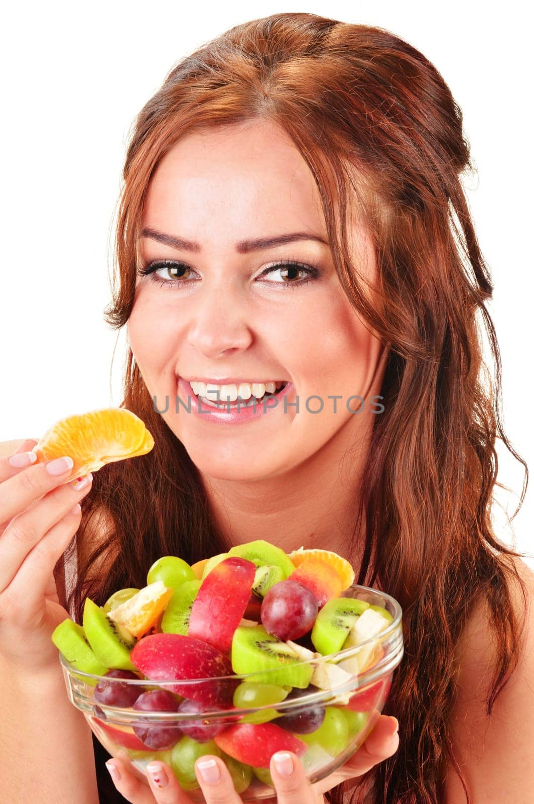 Young woman eating fruit salad