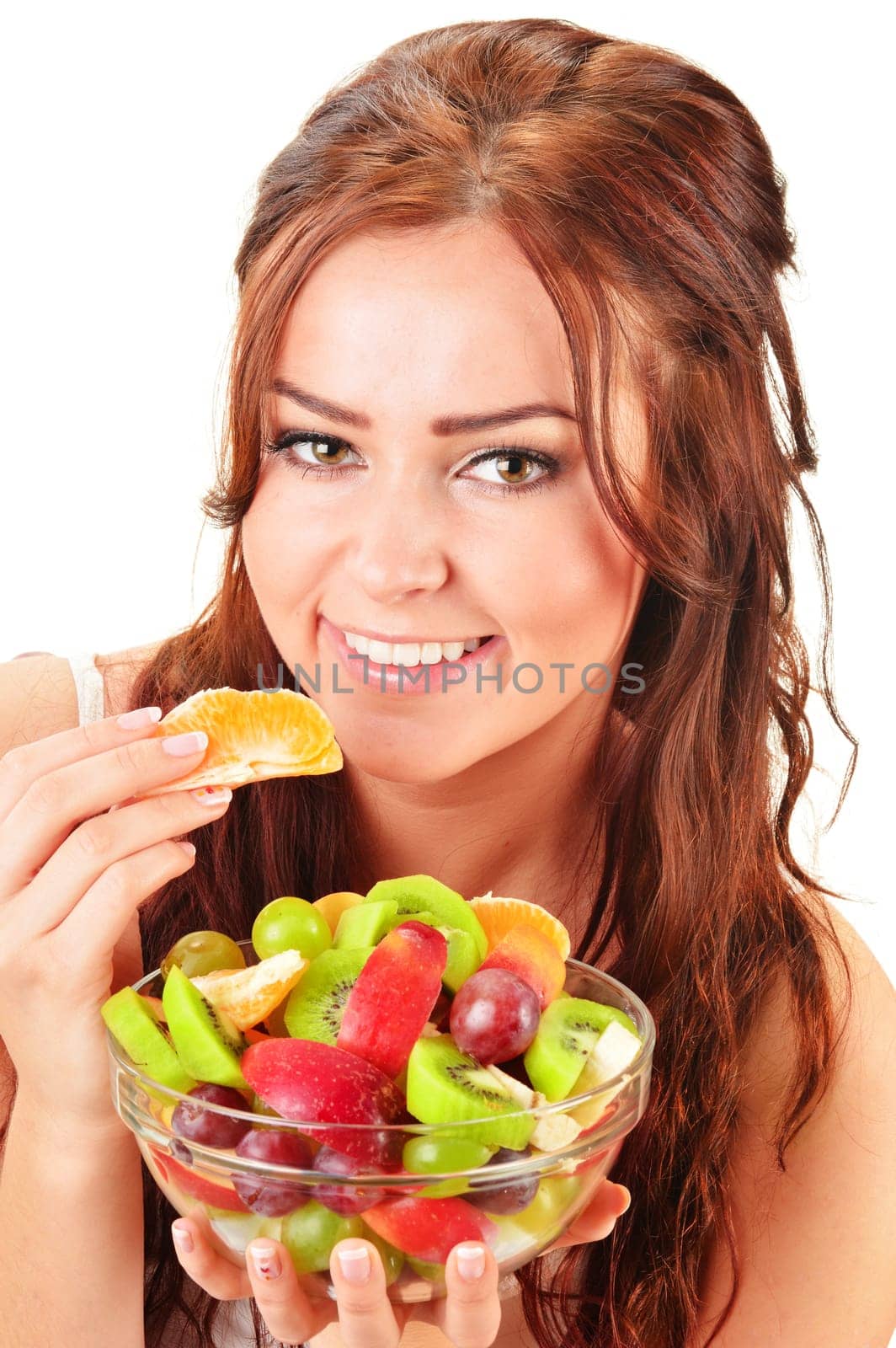 Young woman eating fruit salad