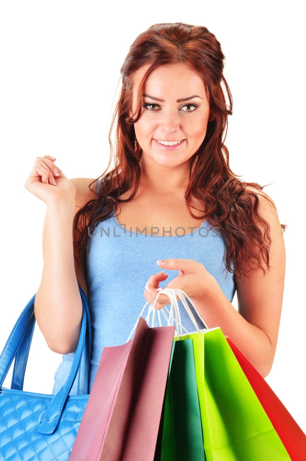 Young woman with shopping bags isolated on white background