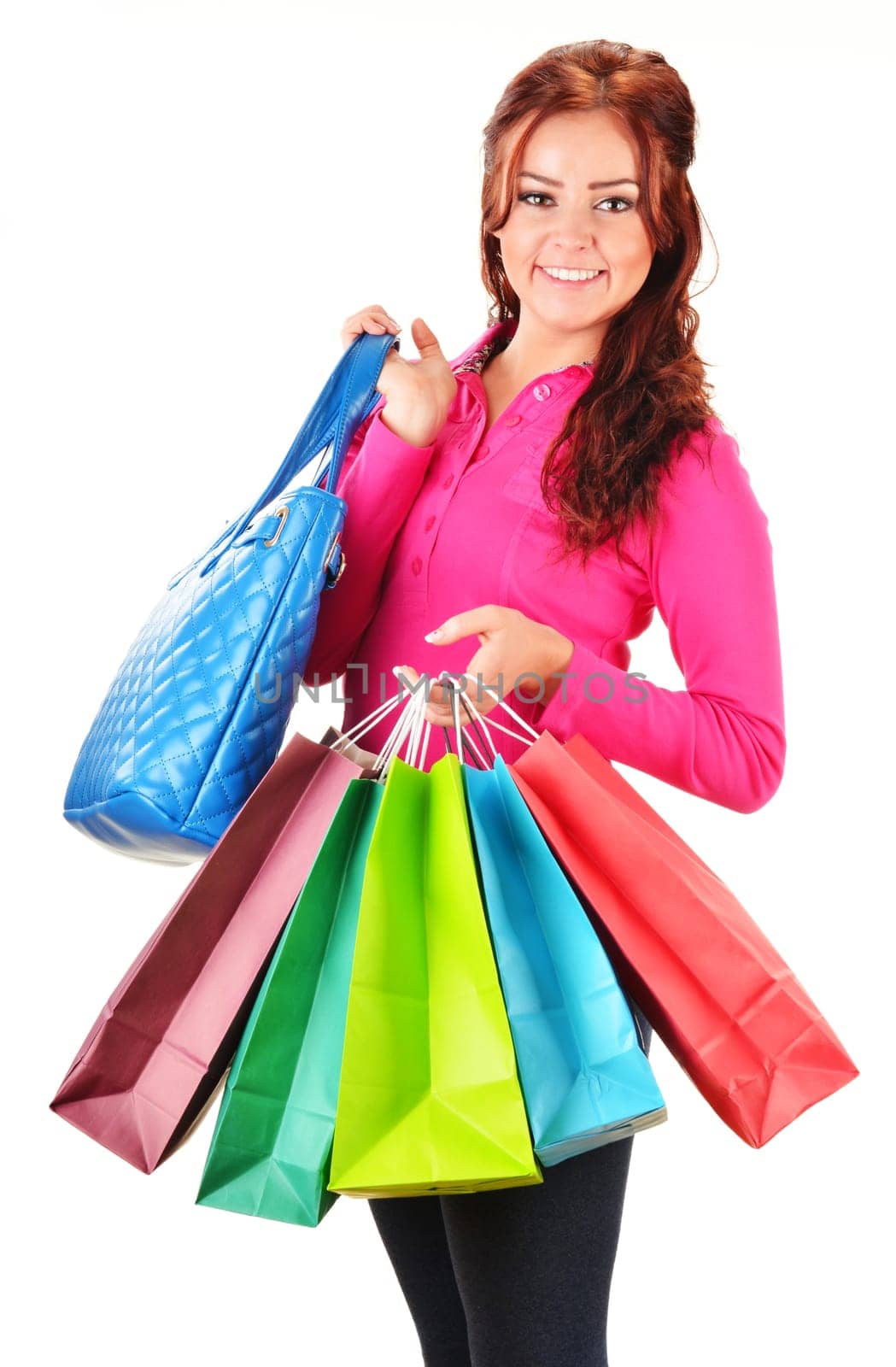 Young woman with shopping bags isolated on white background