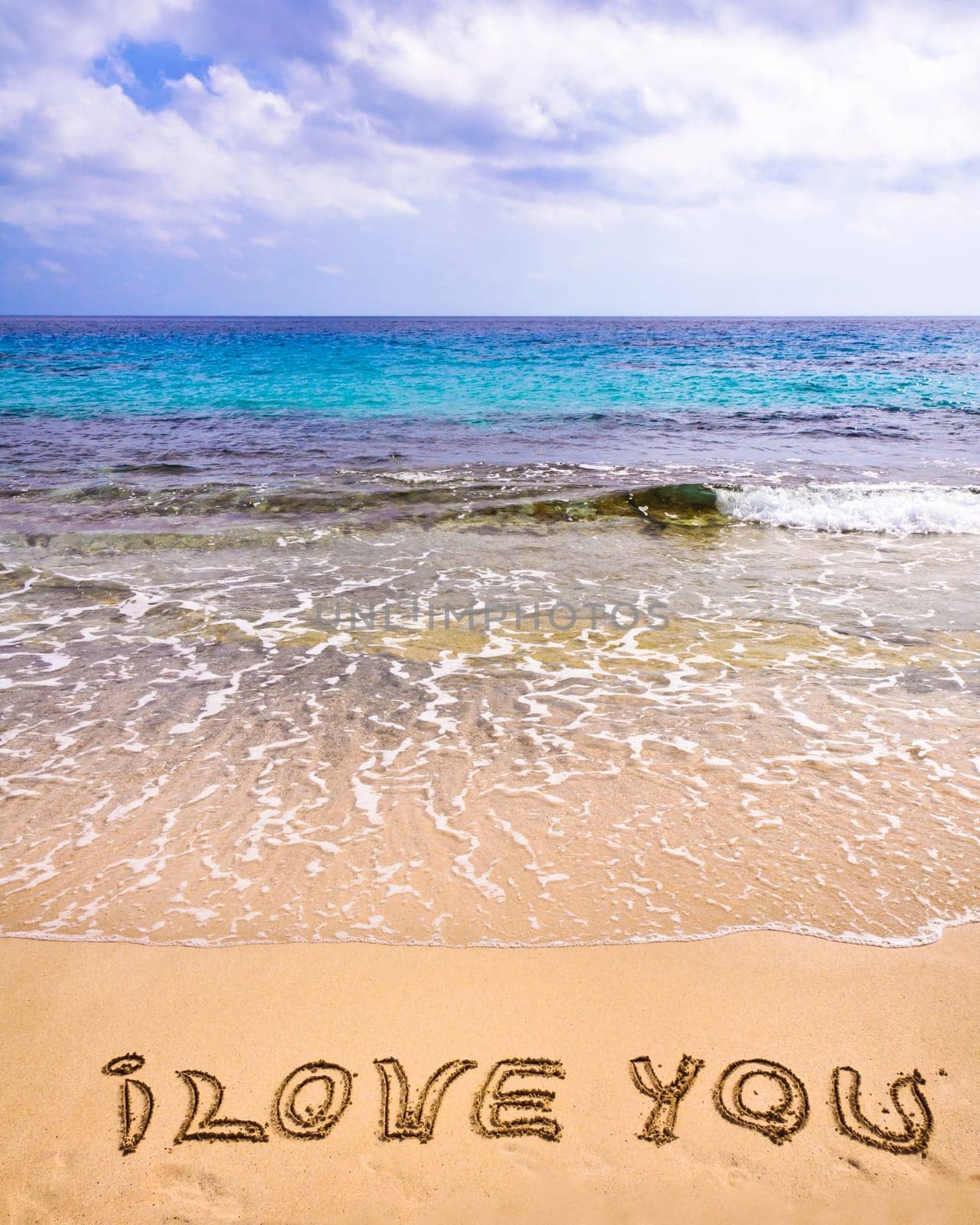 words I Love You written on sand, love concept