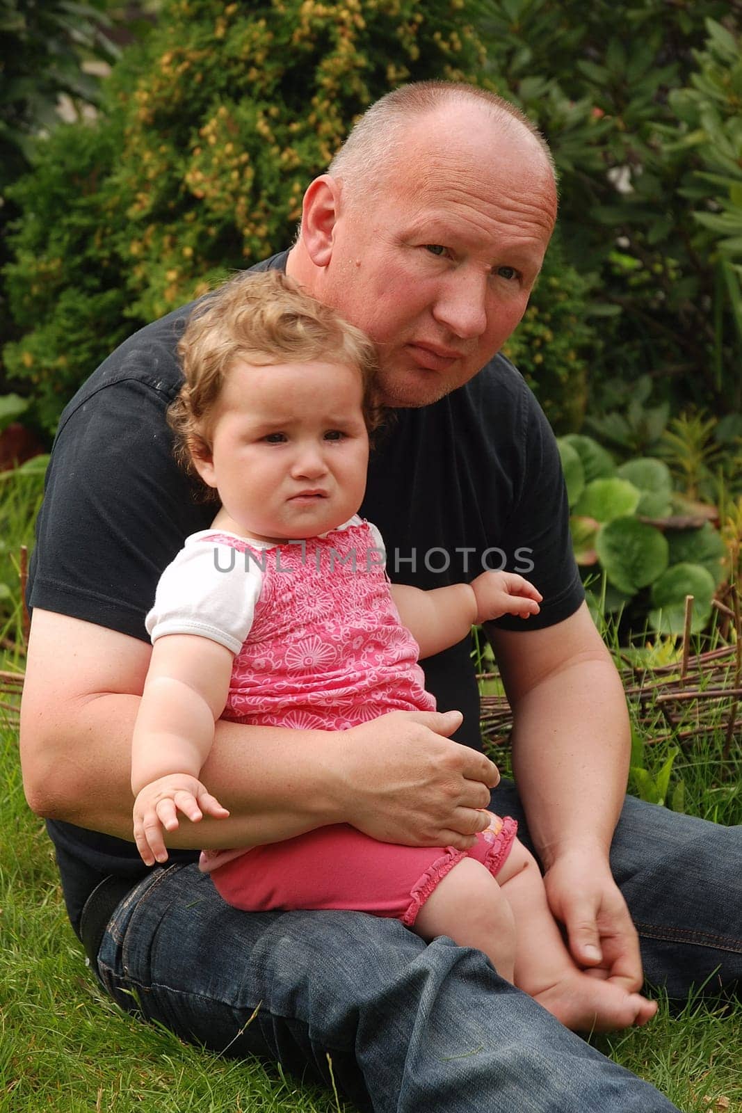 Father comforts girl