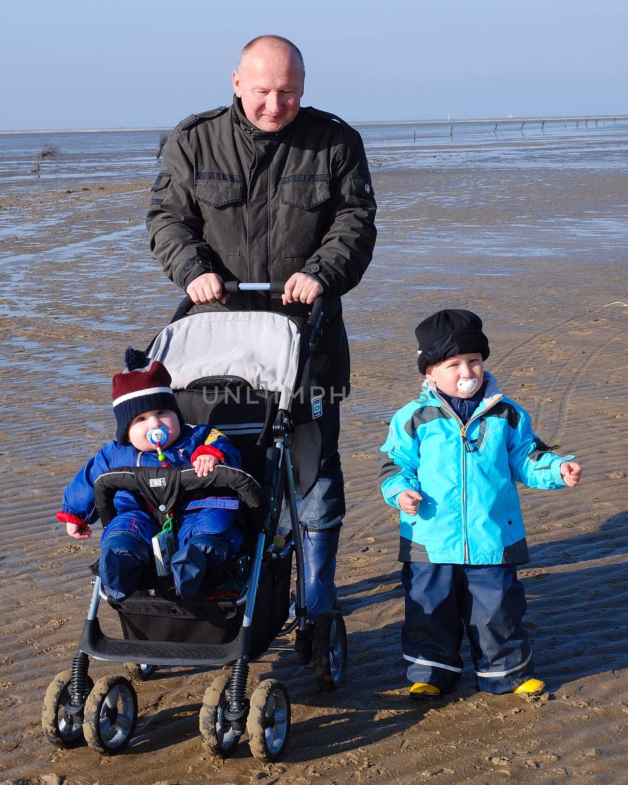 Family on mudflat hiking