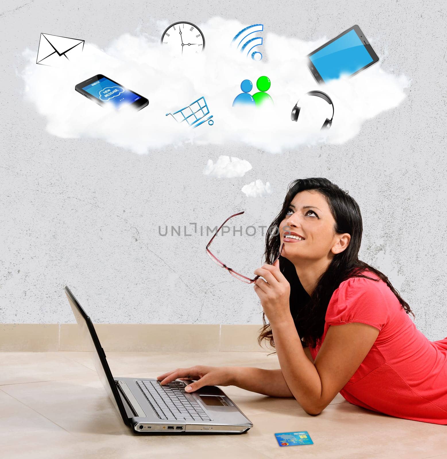 Beautiful Caucasian woman smiles thinking in front of his laptop. Concept of the Internet. Woman lying full length isolated on white background