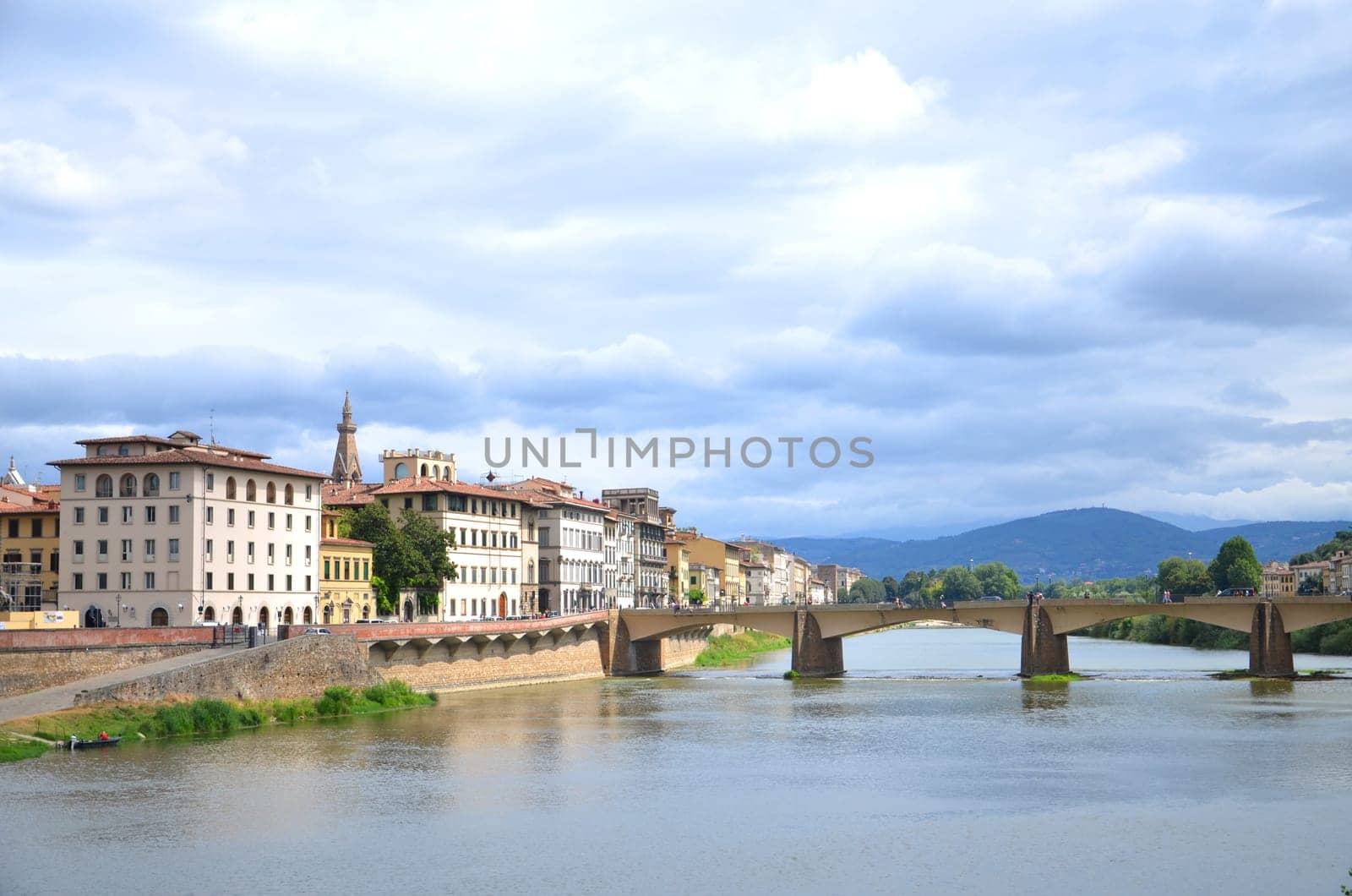 Picturesque view on Bridge alle Grazie over Arno River in Florence, Italy