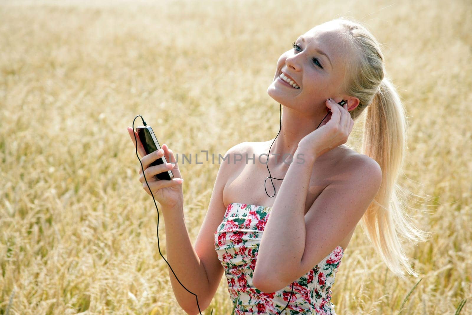 Young attractive woman listening to music