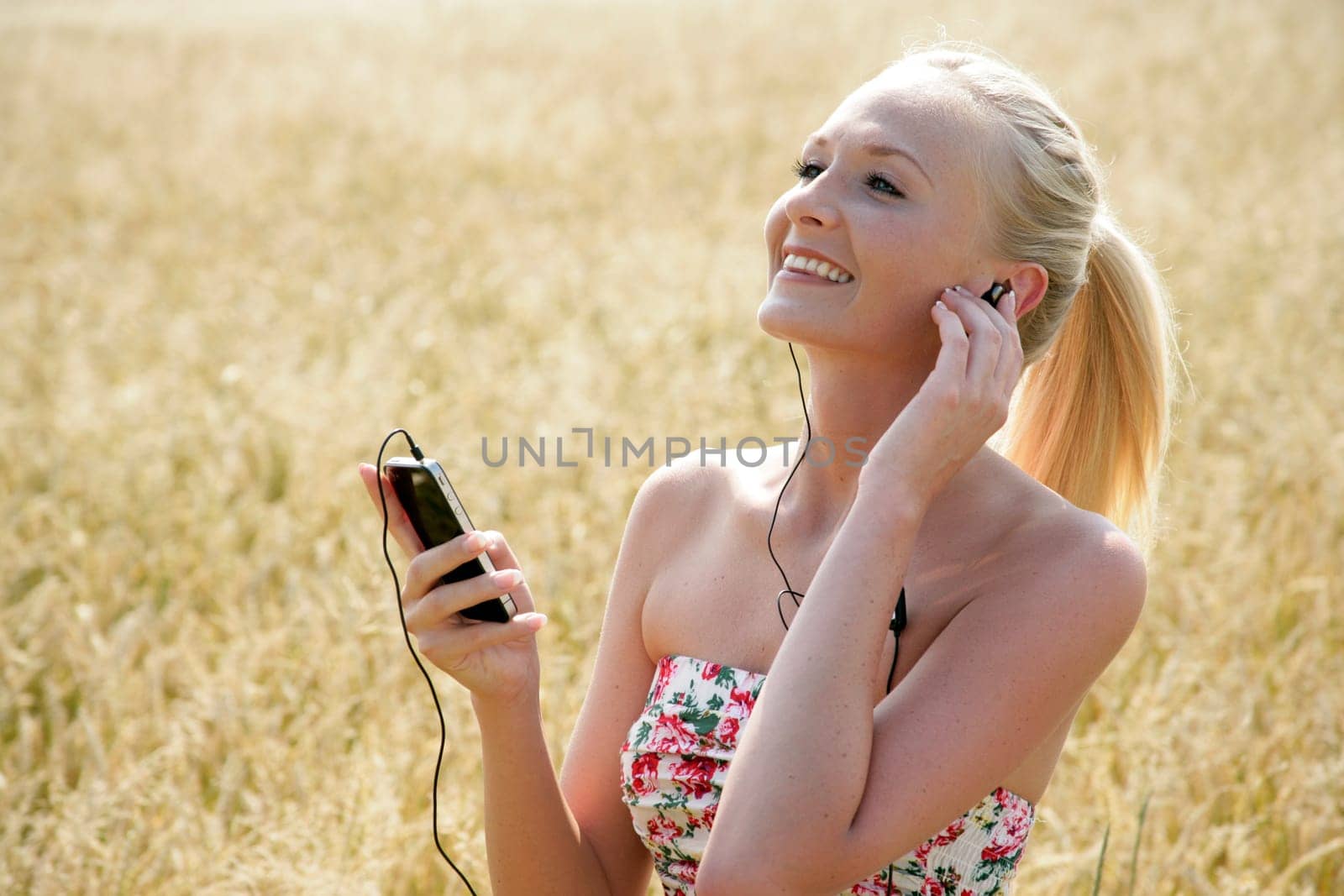 Young attractive woman listening to music