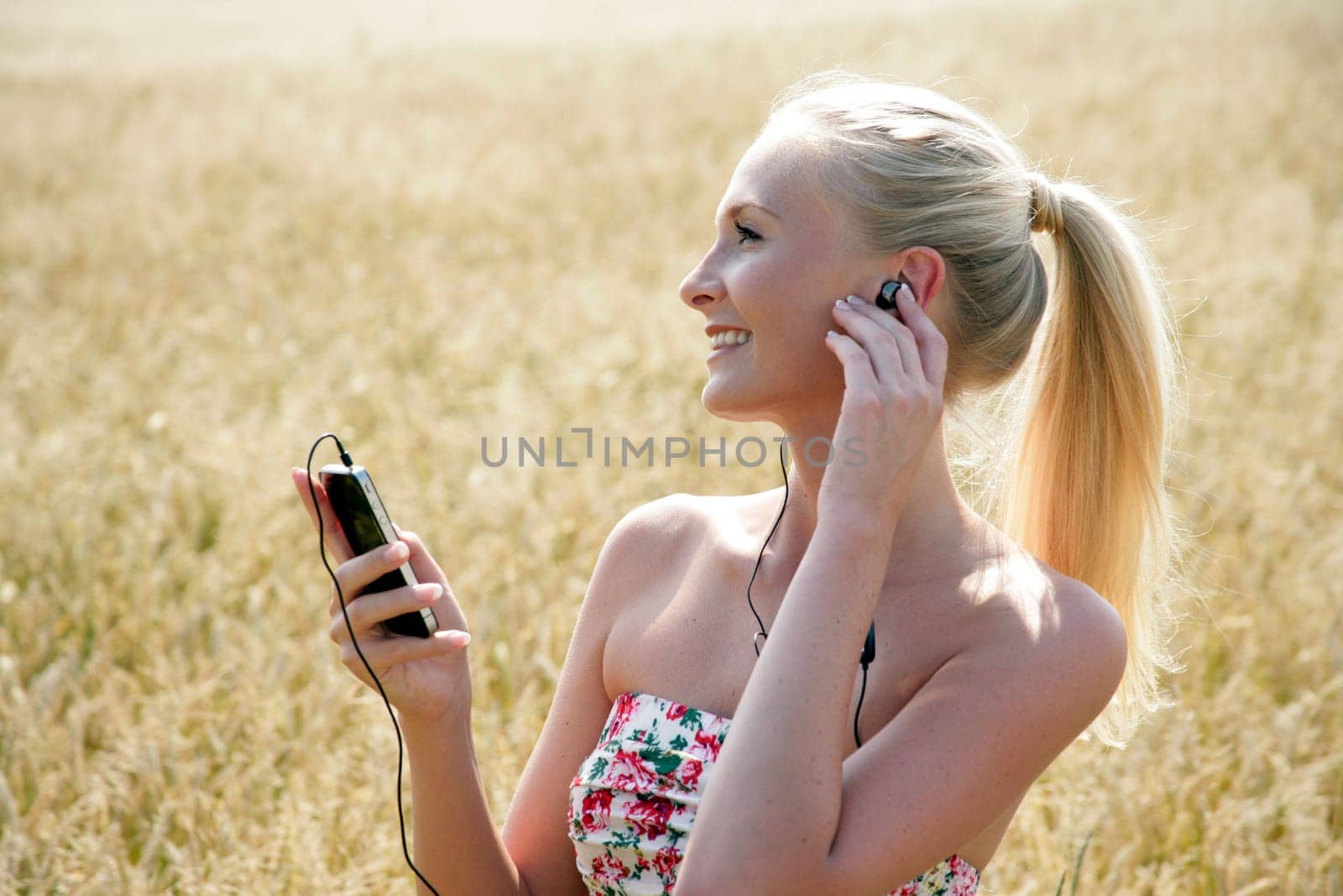 Young attractive woman listening to music