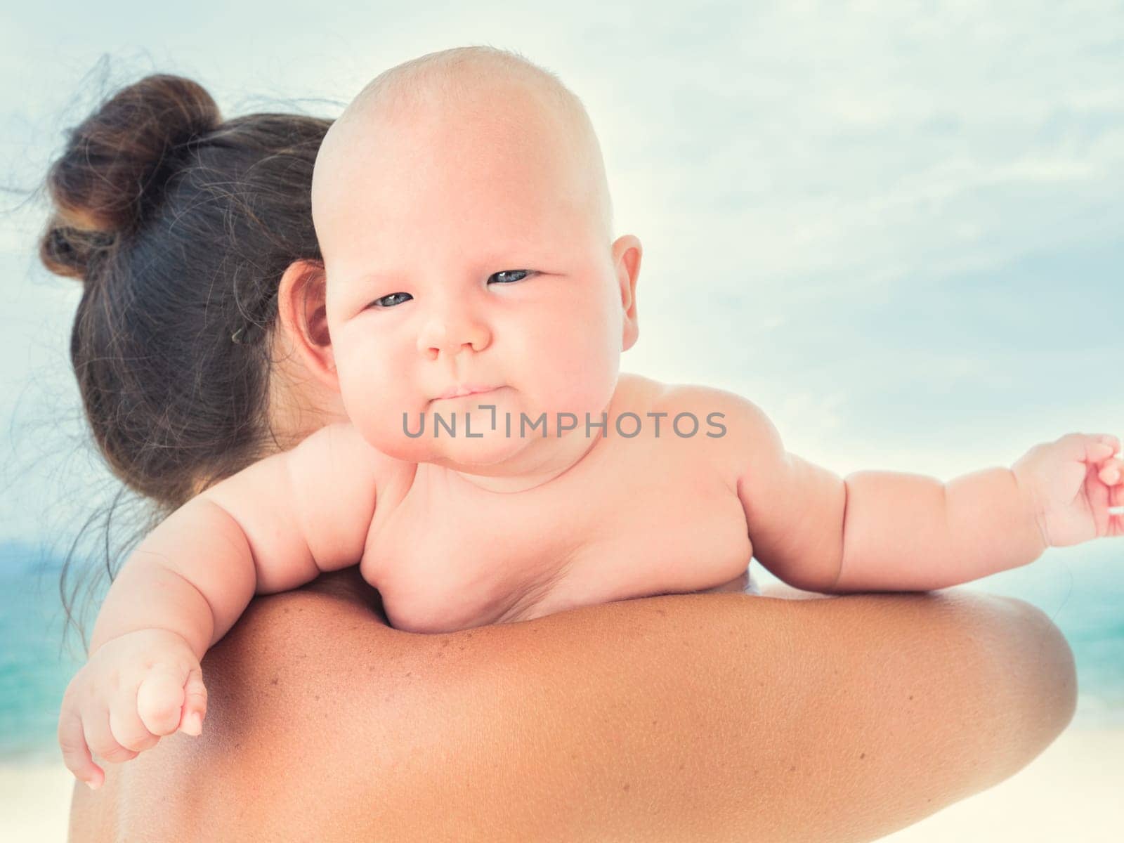 Baby and mom on the beach