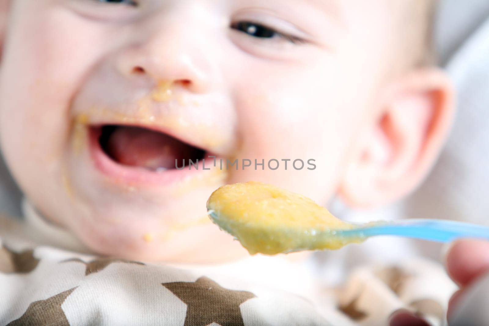 Baby boy eating vegetable mash