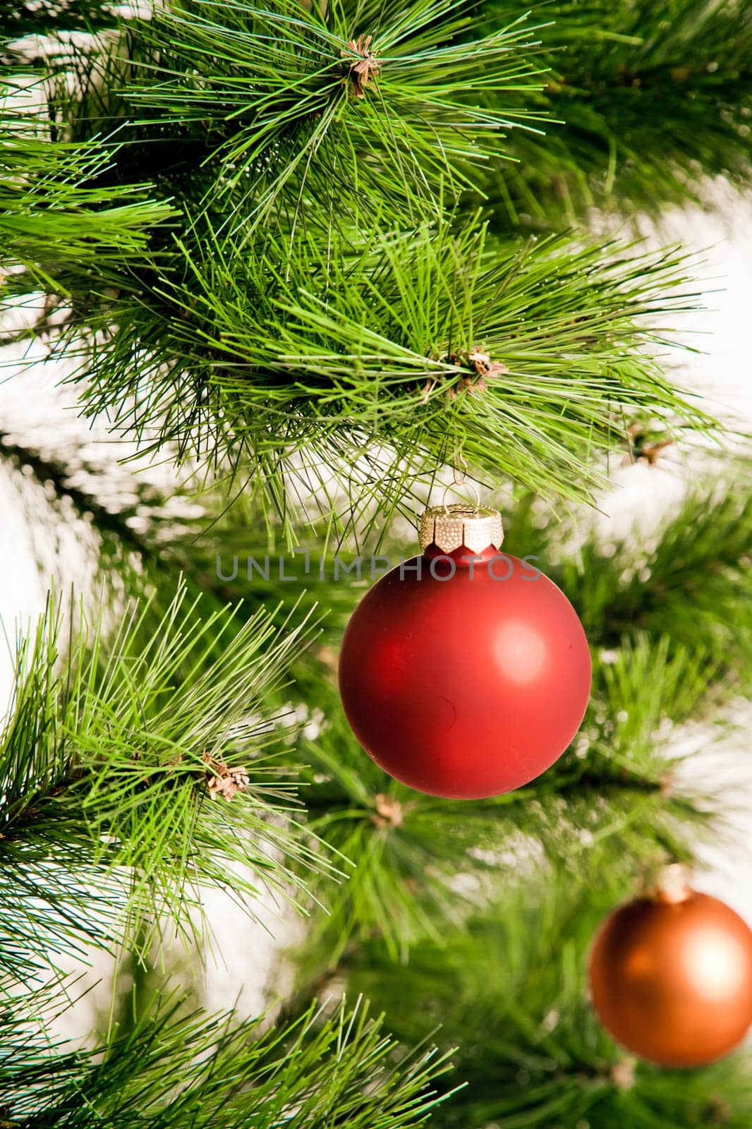 christmas decorations hanging on christmas tree