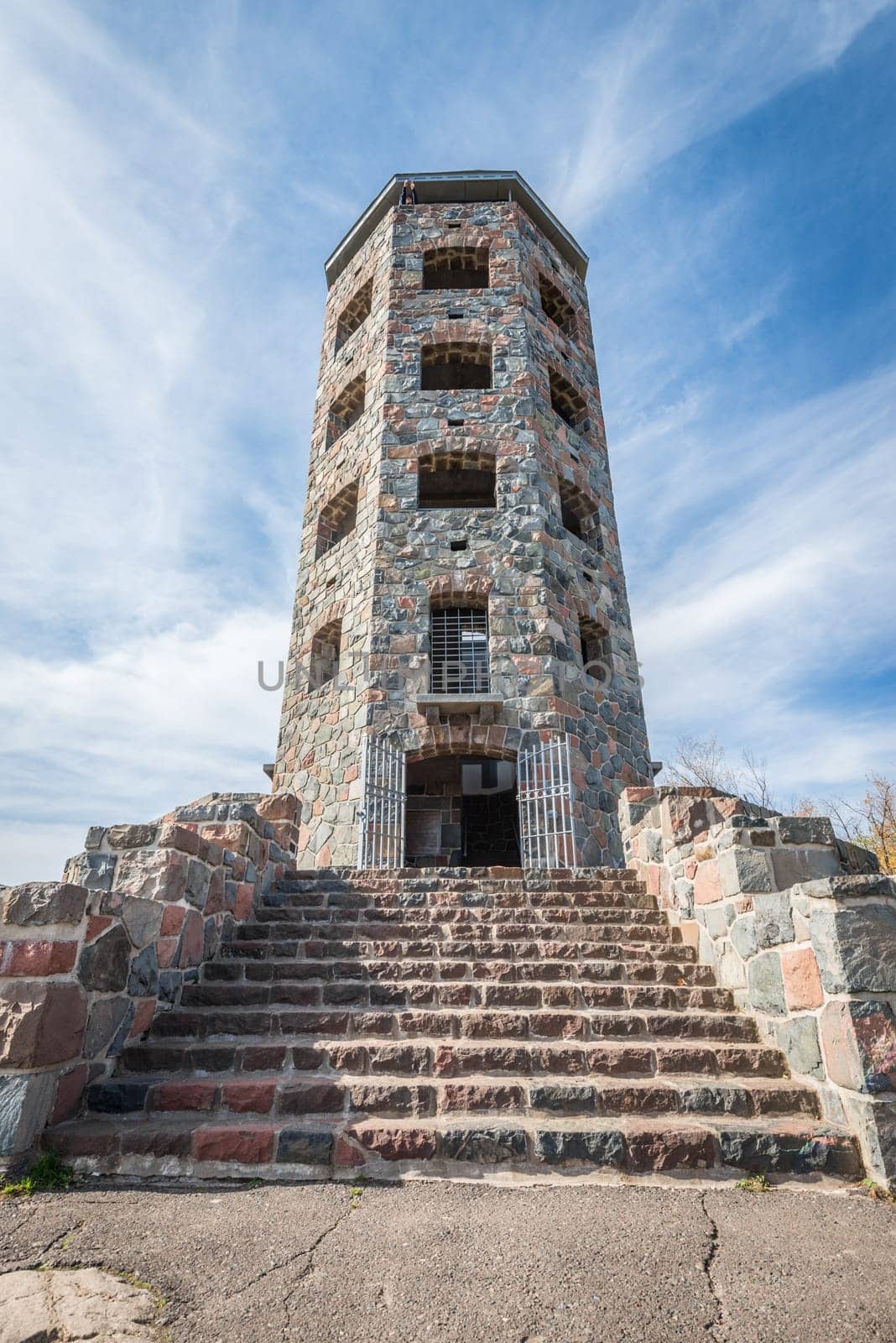 Front entrace of a stone tower during autumn time