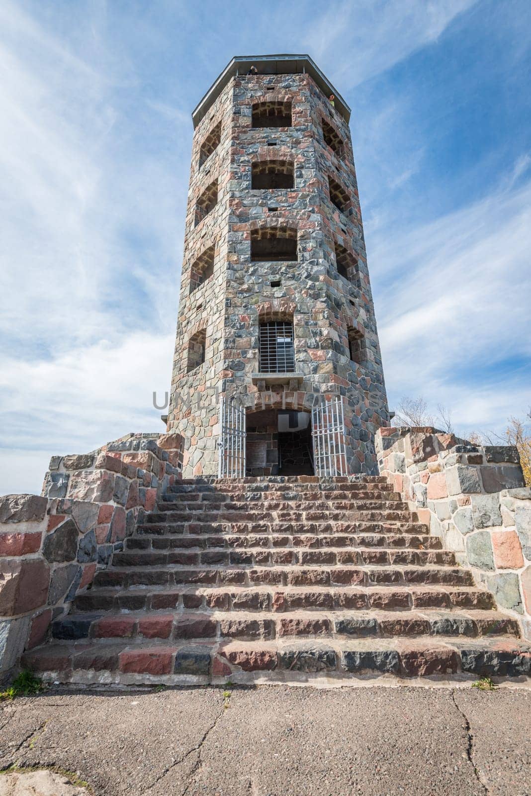 Front entrace of a stone tower during autumn time