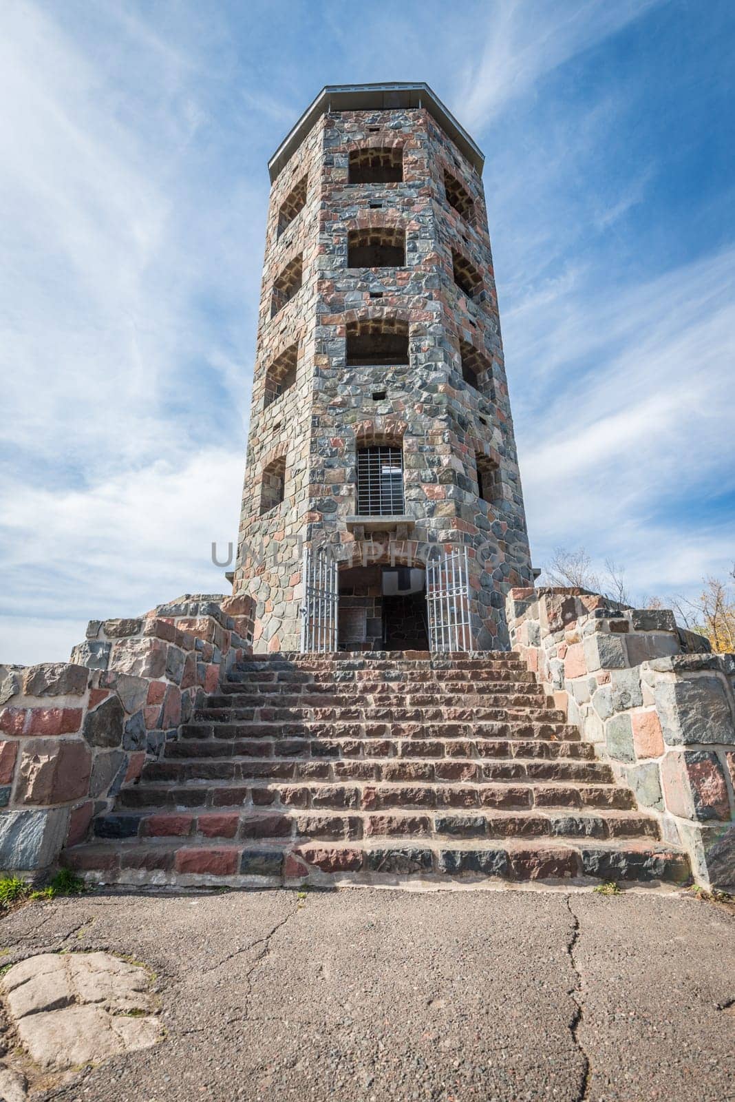 Front entrace of a stone tower during autumn time