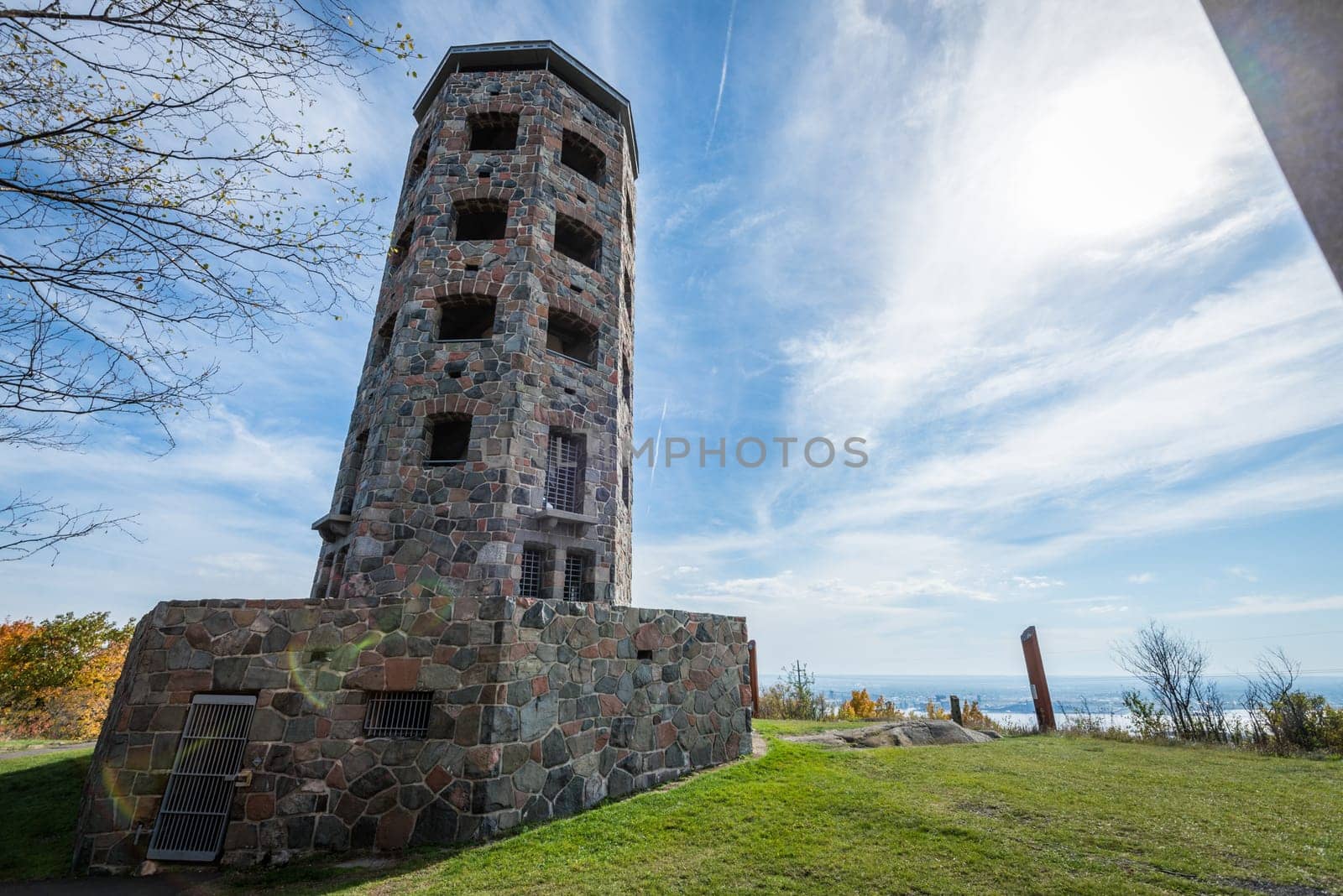 Stone tower in middle of a public park during autumn