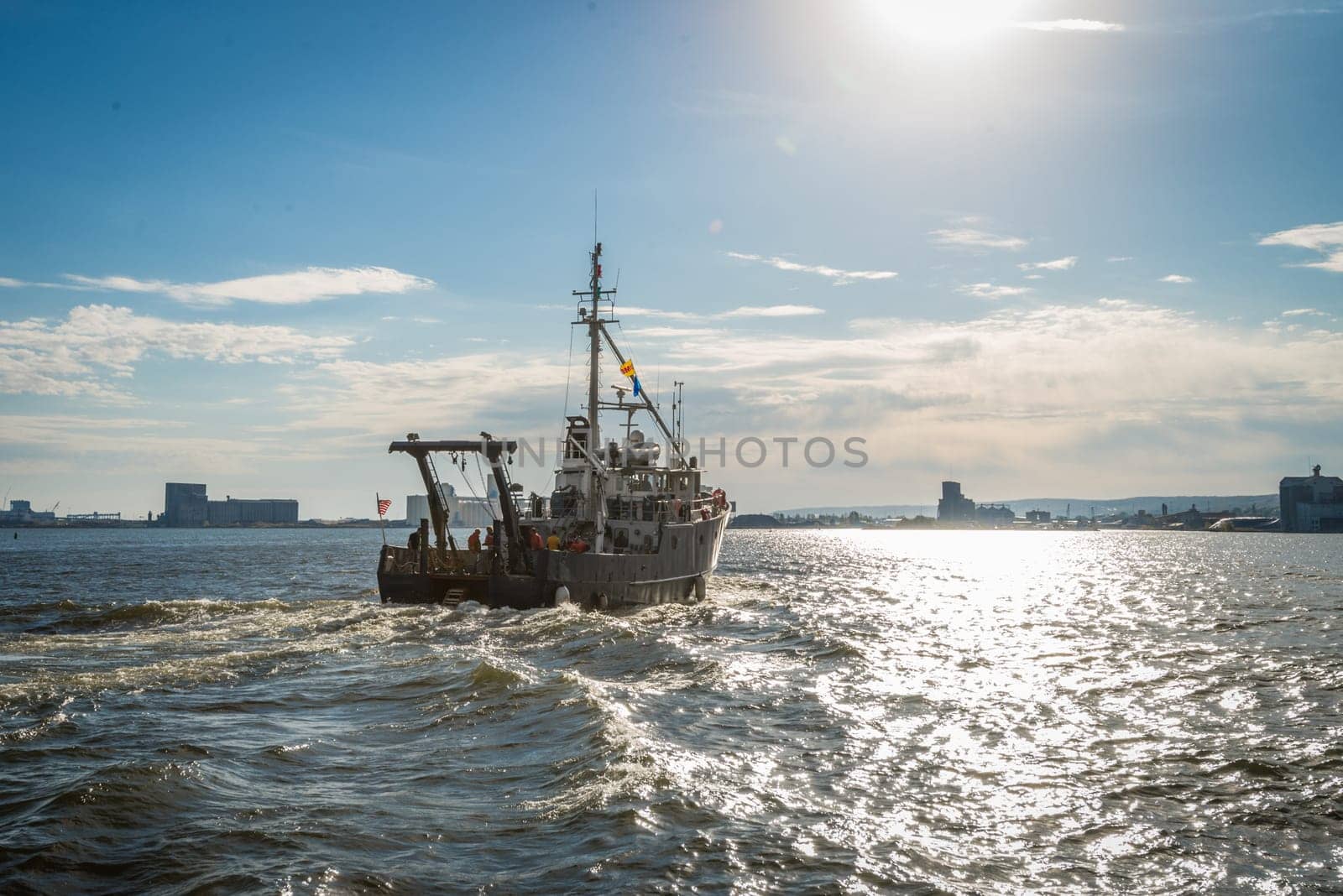 Blue boat moving down a water stream