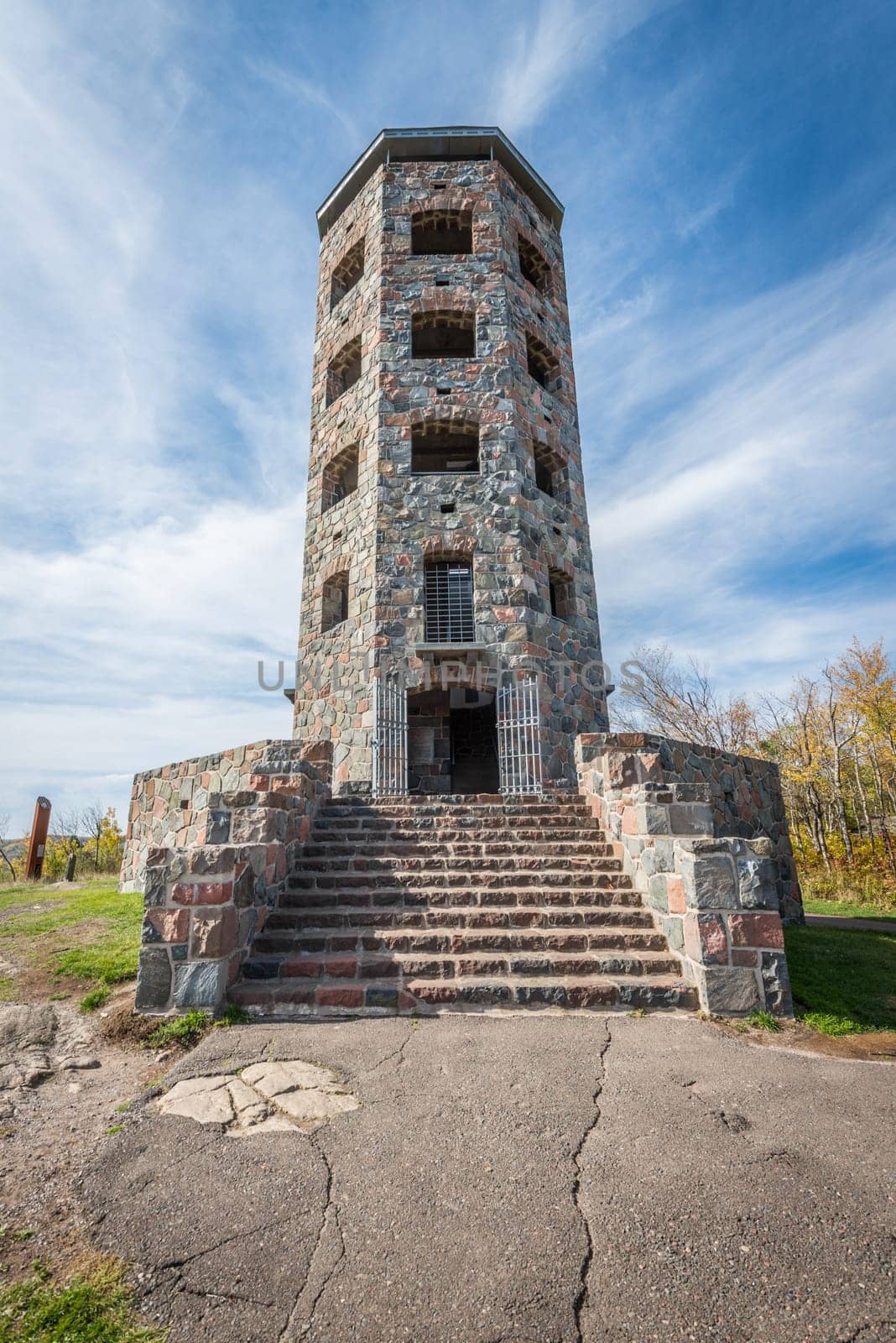 Front entrace of a stone tower during autumn time