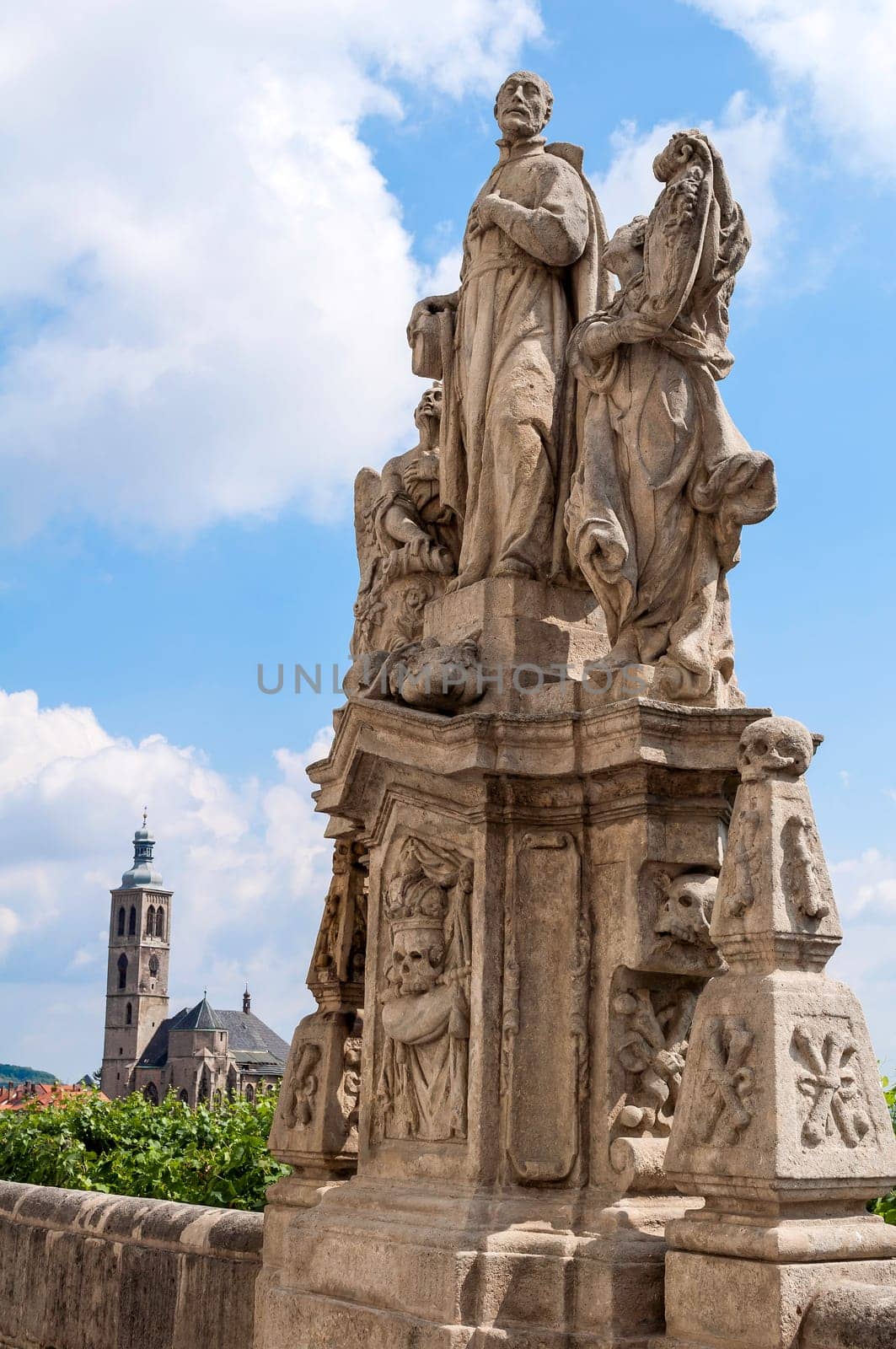 Jesuit priest statue and St. James' Church, in Kutna Hora, Czech Republic.